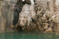 Lion statue on the Fountain of the Four Rivers in the Piazza Navona in Rome Royalty Free Stock Photo