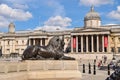 Lion statue and The National Gallery in Trafalgar Square, London, UK Royalty Free Stock Photo