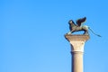 Lion statue at Piazza San Marco St Mark`s Square on blue sky background, Venice, Italy. This place is a tourist attraction of Royalty Free Stock Photo