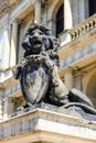 A lion statue with a shield. Kaliningrad, Sculpture of a lion with a shield at the entrance to the Museum of Fine Arts. Royalty Free Stock Photo