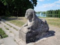 lion statue on the terrace of a white lake pier, date 18th centure.