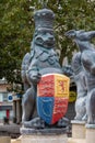 A lion statue wearing a crown and holding a coat of arms as part of the queens silver jubilee statue in Portsmouth city centre Royalty Free Stock Photo