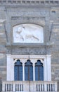Lion of Venice over three windows