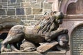 Lion with knight`s armor, stone sculpture, on entrance of Lions Castle, Kassel, Mountain  Park Wilhelmshoehe, Germany Royalty Free Stock Photo