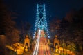 Lions Gate Bridge at night. Cars driving on the bridge with long exposure. Stanley Park, Vancouver, Canada. Royalty Free Stock Photo