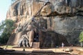 Lions paws entrance to a kings palace with stairs to the top of Sigiriya Rock Fortress. Beautiful unique ancient sculpture carved