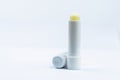 Lip balm for dry, sensitive lips. Opened cap lip care isolated on white background. Lip balm with SPF 15. for rough lip