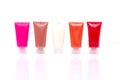 lip gloss color from tube on white background Royalty Free Stock Photo