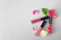 Lip glosses and flowers Royalty Free Stock Photo