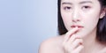 Lip Protection. Closeup of Beautiful Young Asian Woman Healthy Lips. Female Model Touching Her Plush Mouth With Smooth Perfect Royalty Free Stock Photo