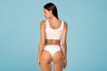 Liposculpture. Slim woman in white underwear with dashed lines on body, collage