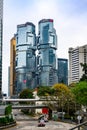 Lippo Centre Hong Kong, skyscraper, with street in front and pedestrian bridge 