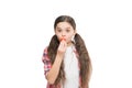 Lips care. Beautiful girl putting on lip balm makeup. Beauty look of adorable small girl. Little child with cute beauty Royalty Free Stock Photo