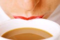 Lips on cup of coffee with milk Royalty Free Stock Photo