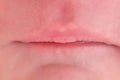 Lips on the face of a newborn baby, close-up. Macro photo of a healthy child mouth Royalty Free Stock Photo