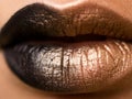 Lips make-up. Beauty high fashion trendy black with gold colour gradient lips makeup sample, mouth closeup.