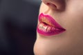 Lips make-up. Beauty high fashion trendy gradient lips makeup sample, purple with golden color, sexy mouth closeup. Lipstick