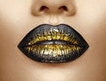 Lips makeup. Beauty high fashion gradient lips makeup sample, black with golden color. mouth. Lipstick