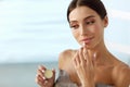 Lips Skin Care. Woman With Beauty Face Applying Lip Balm On Royalty Free Stock Photo