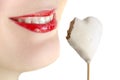 Lips smiling with heart-shape cookie isolated