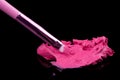 Lipstick with a brush make-up on black Royalty Free Stock Photo