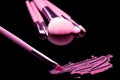 Lipstick with a brush make-up on black Royalty Free Stock Photo