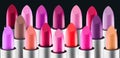 Lipstick colourful tints palette. Fashion Various colors Lipsticks isolated on black background, Professional Makeup Royalty Free Stock Photo