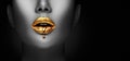 Lipstick dripping. Paint drips, lipgloss dripping from sexy lips, liquid Gold metallic paint drops on beautiful model girl`s mouth Royalty Free Stock Photo