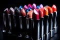 Lipstick. Fashion Colorful Lipsticks over black background, Beautiful Make-up concept