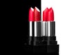 Lipstick. Fashion red Colorful Lipsticks isolated on black and white background Royalty Free Stock Photo