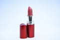 Lipstick for professional make up. Adding some shine to lips. Lip care concept. Lipstick on white background. Water