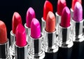 Lipstick. Professional makeup and beauty. Lipstick tints palette closeup. Colorful lipsticks over black