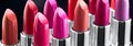 Lipstick. Professional makeup and beauty. Lipstick tints palette closeup. Colorful lipsticks over black