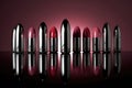 lipstick tubes reflecting on a glossy surface Royalty Free Stock Photo