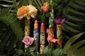 lipstick tubes with tropical flowers and leaves