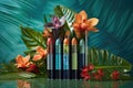 lipstick tubes with tropical flowers and leaves Royalty Free Stock Photo