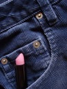 Lipstick tucked in pocket of jeans Royalty Free Stock Photo