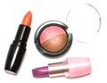 Lipsticks and eye-shadows Royalty Free Stock Photo