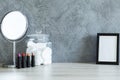 Lipsticks, mirror, cotton pads and mockup frame Royalty Free Stock Photo