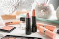 Lipsticks and other cosmetics on table Royalty Free Stock Photo