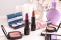 Lipsticks and other cosmetics on table Royalty Free Stock Photo