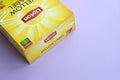 Lipton Yellow Label black tea pack on pastel lilac surface close up. Lipton is a world famous brand of tea