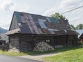 Liptovska luzna, Low Tatras, Slovakia, August 30, 2020: Old shabby log cabin cottage, timbered rural house with rusty