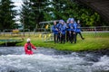 Liptovsky Mikulas / Slovakia - June 22, 2019: a group of people being instructed how to swim with life jacket at rafting training