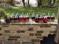 Liqueur drink making in glass bottles under the sun of wild cherries in zagoria greece