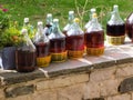 Liqueur drink making in glass bottles under the sun of wild cherries in zagoria greece