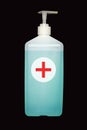 Liquid antiseptic for hands and face disinfection in high plastic dispenser isolated on black background studio shot vertical view