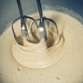 Liquid batter for pie, stirred with a mixer