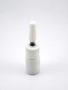Liquid black refill ink placed in small white plastic bottle Royalty Free Stock Photo