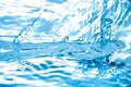 Liquid blue water drops waves and ripples Royalty Free Stock Photo